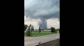 RIVETING footage of a fierce tornado eyeing Carstairs, Canada