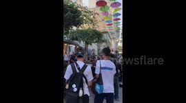 People Listen to Free Street Concert in Jerusalem, Israel