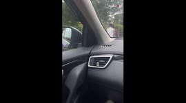 Woman catches son riding a bicycle with his girlfriend seated atop the handlebars