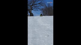 Sledding couple sliding down an unsafe hill feels the thrill... and then a BAM!