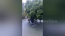 Minibus flipped over after being swept away by flash floods in Indonesia's Padang