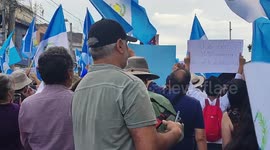 Protesters gather in front of the MP for the case against Semilla in Guatemala City, Guatemala