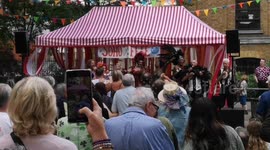 At the end of the Soho Village Fete the audience take part in a rendition of a famouse song with its words changed to Soho, Soho