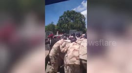 Fanatic locals throw rocks at police in chaotic Buddhist temple standoff in Thailand