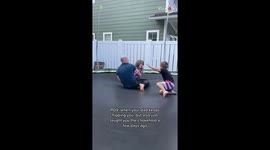 Girl makes good on her Jiu Jitsu training by surprising dad with a headlock
