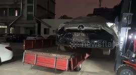 Disastrous auto repair mishap: Mercedes Benz plummets off forklift, front bumper lost!