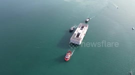 Floating accommodation block the Bibby Stockholm arrives in Portland to protests from locals