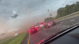 Debris flies in air as cluster of storms rolls through US state of Alabama