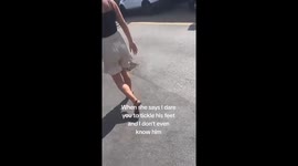 A woman has gone viral after sharing a video of herself tickling an unsuspecting stranger's foot as they napped in a car – leaving the internet howling with laughter.