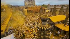 Indian town turns yellow as turmeric is thrown across streets for Bhandara Festival