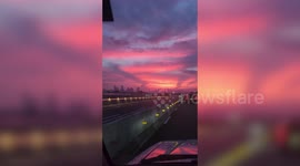 Sky turns awesome bright pink and orange during sunrise in Manila