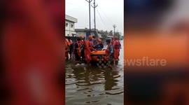 Officials conduct rescue operations in flooded Gir Somnath, Gujarat, India