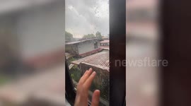 Sliding window falls outside home as resident tries to open it and watch rain