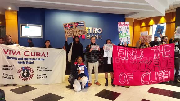 Cuban activists lecture the bank.  The .metro bank london uk