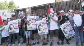 Palestinian families take part in protest demanding to hand over the bodies of detained by the Israeli army in front of Red cross office, in the West Bank city of Jenin