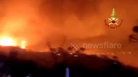 Raging wildfires engulf Sicily as hail and storms batter north Italy