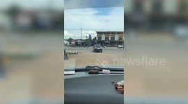 Wide load! Passenger carries five 10ft-long pipes outside moving car's window