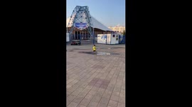 Joyful puddle escapade: a father's hilarious chase in Minsk