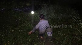 Join this Vietnamese farmer as he fishes for shrimp and crabs in flooded fields