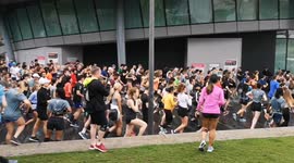 A massive group of runners start running from Potters Fields Park on the northbank of the River Thames
