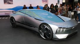 A futuristic Porsche Car is displayed at the Outernet building in London