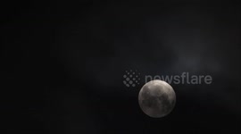 The Supermoon Passes Through Clouds in Yichang, China