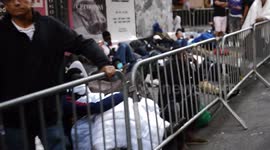 Migrants From Various Nations Line Up for Shelter at Roosevelt Hotel in New York