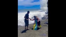 Unsuspecting seaside silliness: a chair, a wave, and laughter in Banda Aceh!