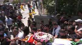 Palestinians carry the body of Qusai Maatan, 19, during his funeral in the village of Burqa in the north of the  West Bank