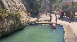 Palestinians swim in the ancient spring in the West Bank village of Battir, located between Jerusalem and Bethlehem
