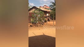 Locals carry entire house to new location in Cambodia