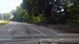 A Driver in Philadephia avoids a truck that pulls out in front of them across 2 lanes