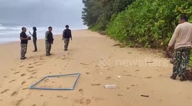 Volunteers battle to remove oil spill from beaches in southern Thailand