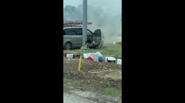 Bystanders Rush To Rescue Equipment From Burning Van