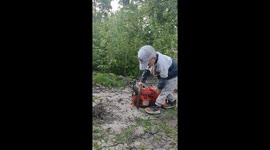 Little Man Frustrated About His Broken Chainsaw