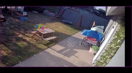 Three year old boy riding tractor in backyard crashes and flies off the front