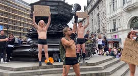 Animal rights activists strip into their underwear and promote veganism in Piccadilly Circus