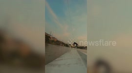 Kite surfer slams when he lands on jump ramp platform