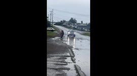 Kids love being splashed by the puddle water when a car passes by them