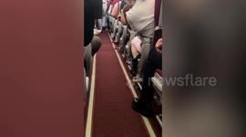 Flight attendant catches pet cat running along plane cabin aisle in China
