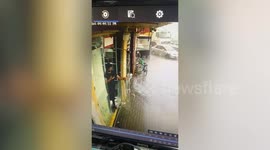 Glass door blown by strong wind shatters during storm in UAE