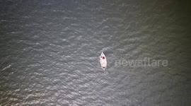 Stockshots: Boat Crossing Buriganga River with Passengers in Dhaka, Bangladesh