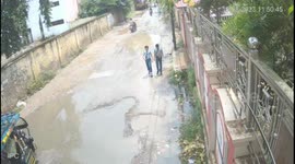 E rikshaw with passengers turns down on road due to big potholes