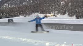 Snowboarder towed by plane at 125kph