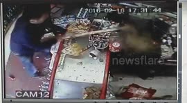 Gang of youths smash up a shop with sticks