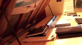 Bed transforms into desk with two monitors and computer