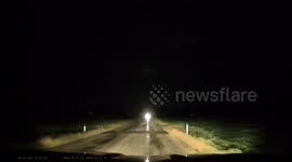 Lightning, downed trees, and heavy rain: Motorist drives through tornado-impacted town in Michigan