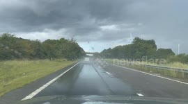 Major motorway partly flooded after heavy rain storm in eastern England