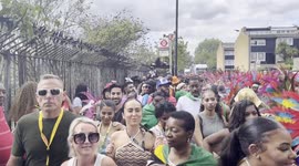 Bus stop shakes at Notting Hill Carnival as women dance on top of it