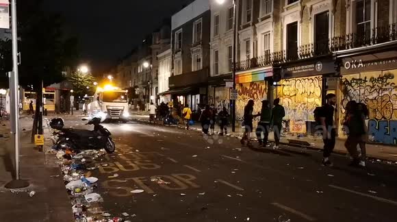Rubbish vans start to clean up the roads after the Notting Hill Carnival